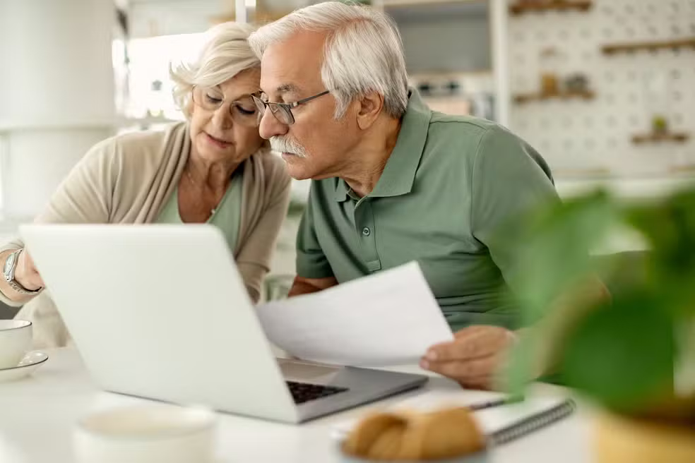 senior-couple-analyzing-their-savings-while-going-through-home-finances